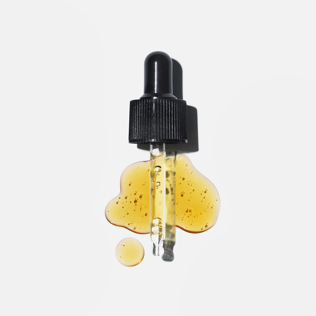 Close-up of Versed serum orange color highlighting potent vitamin C visual cue