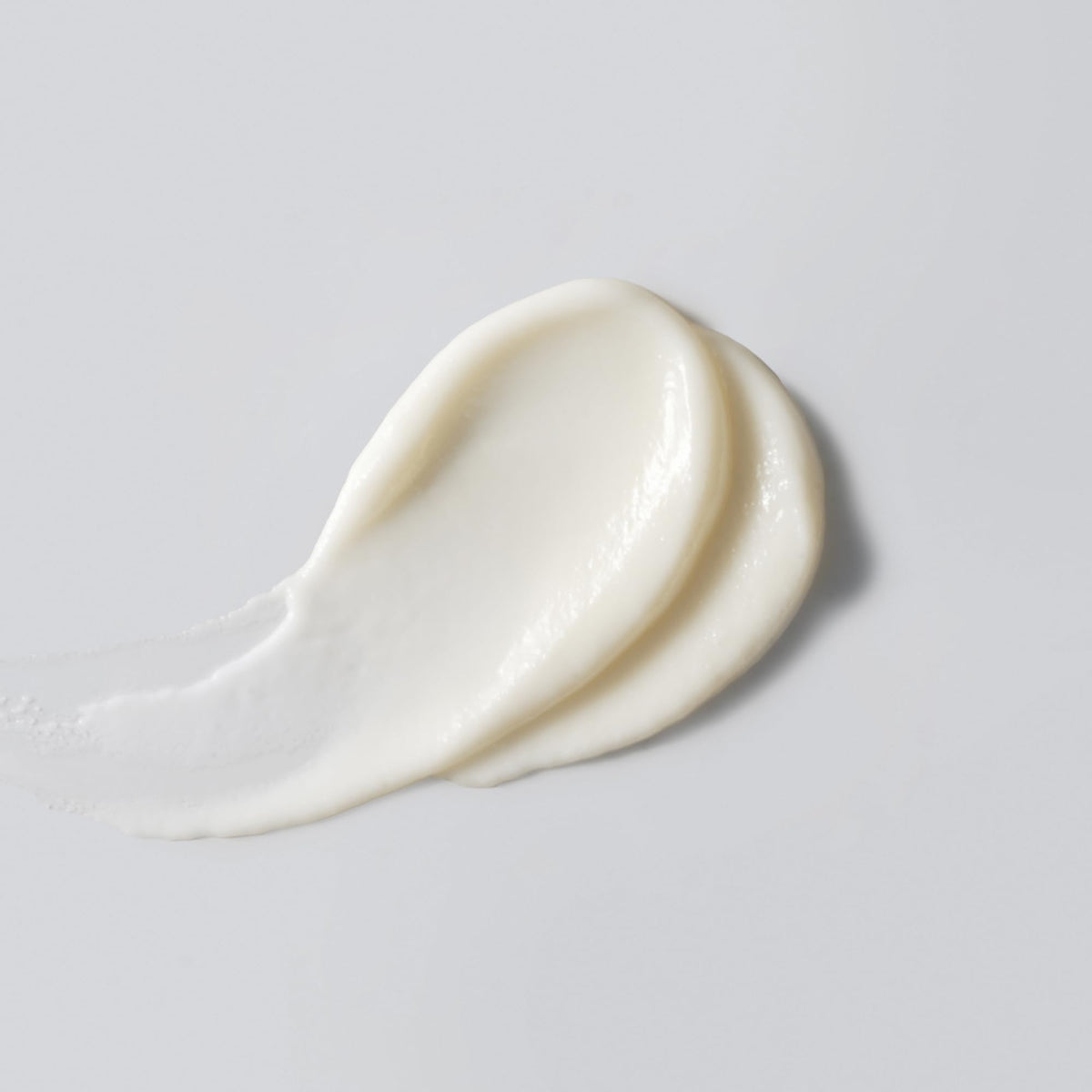 Versed sunscreen texture close-up demonstrating sheer finish and absorbency