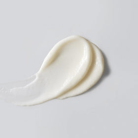 Versed sunscreen texture close-up demonstrating sheer finish and absorbency