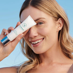 VI DERM sunscreen in a beach bag conveying portable UV defense and ease