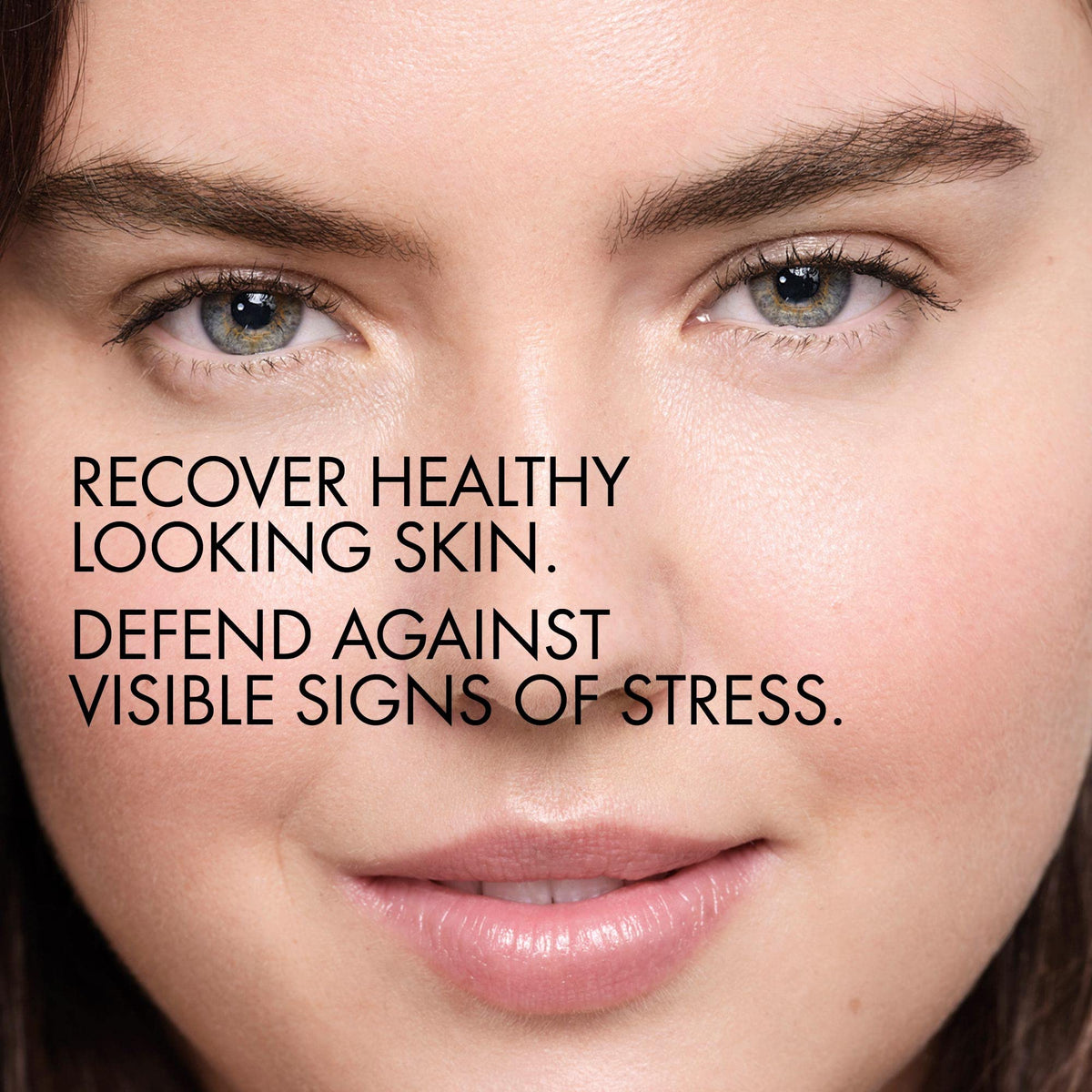 Vichy serum applied to cheek illustrating dewy, hydrated skin finish