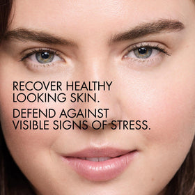 Vichy serum applied to cheek illustrating dewy, hydrated skin finish