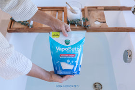 Vicks VapoBath handful being measured for consistent soothing bath benefit