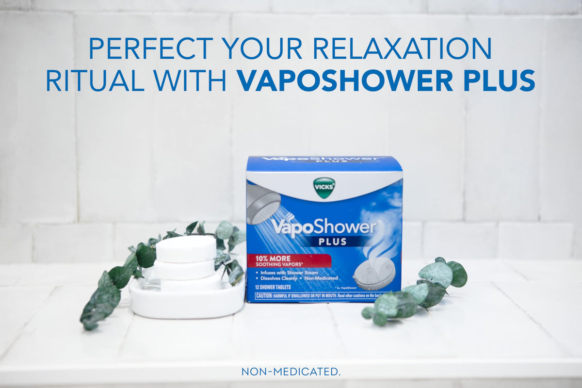 Vicks VapoShower PLUS tablet close-up showing texture and aroma-enhancing design
