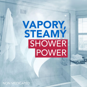 Vicks VapoShower PLUS tablet beside coin to show compact single-use size