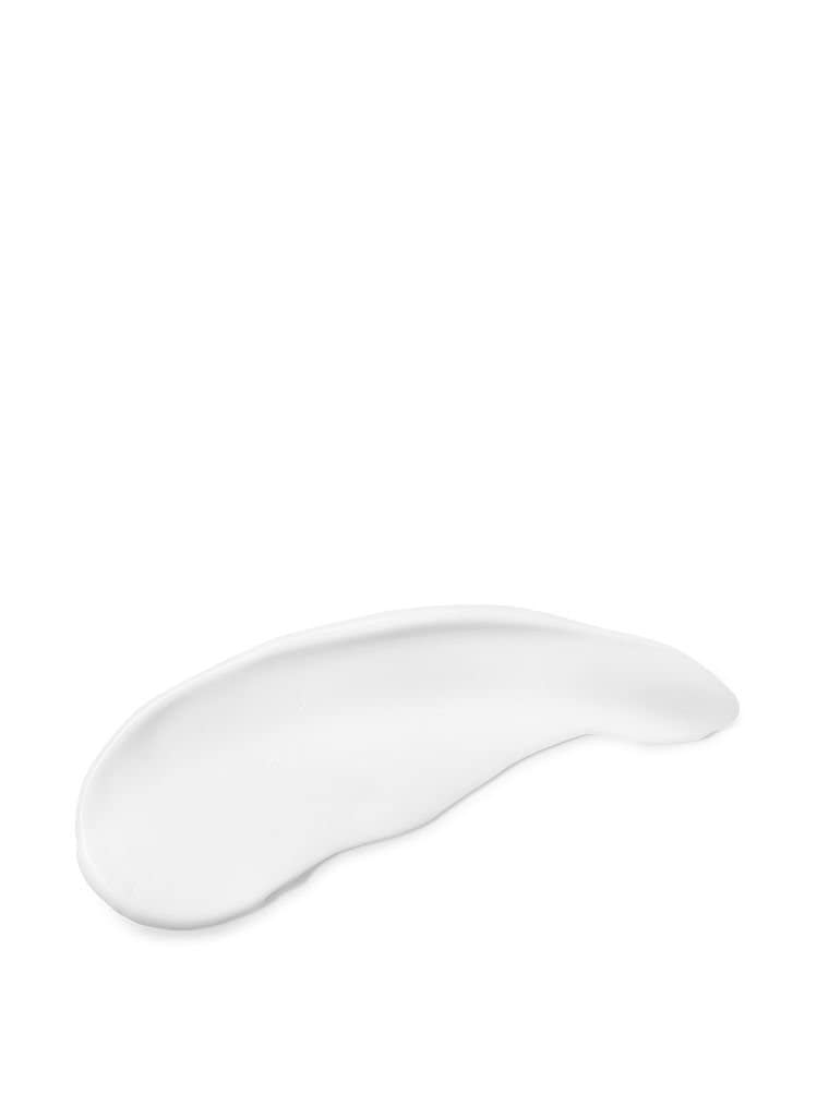 Victoria's Secret applying lotion on hand to show smooth hydration benefit