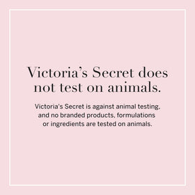Victoria's Secret lifestyle flatlay with lotion and mist suggesting layered scent use