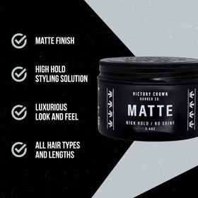Victory Crown pomade in hands being warmed for smooth even application