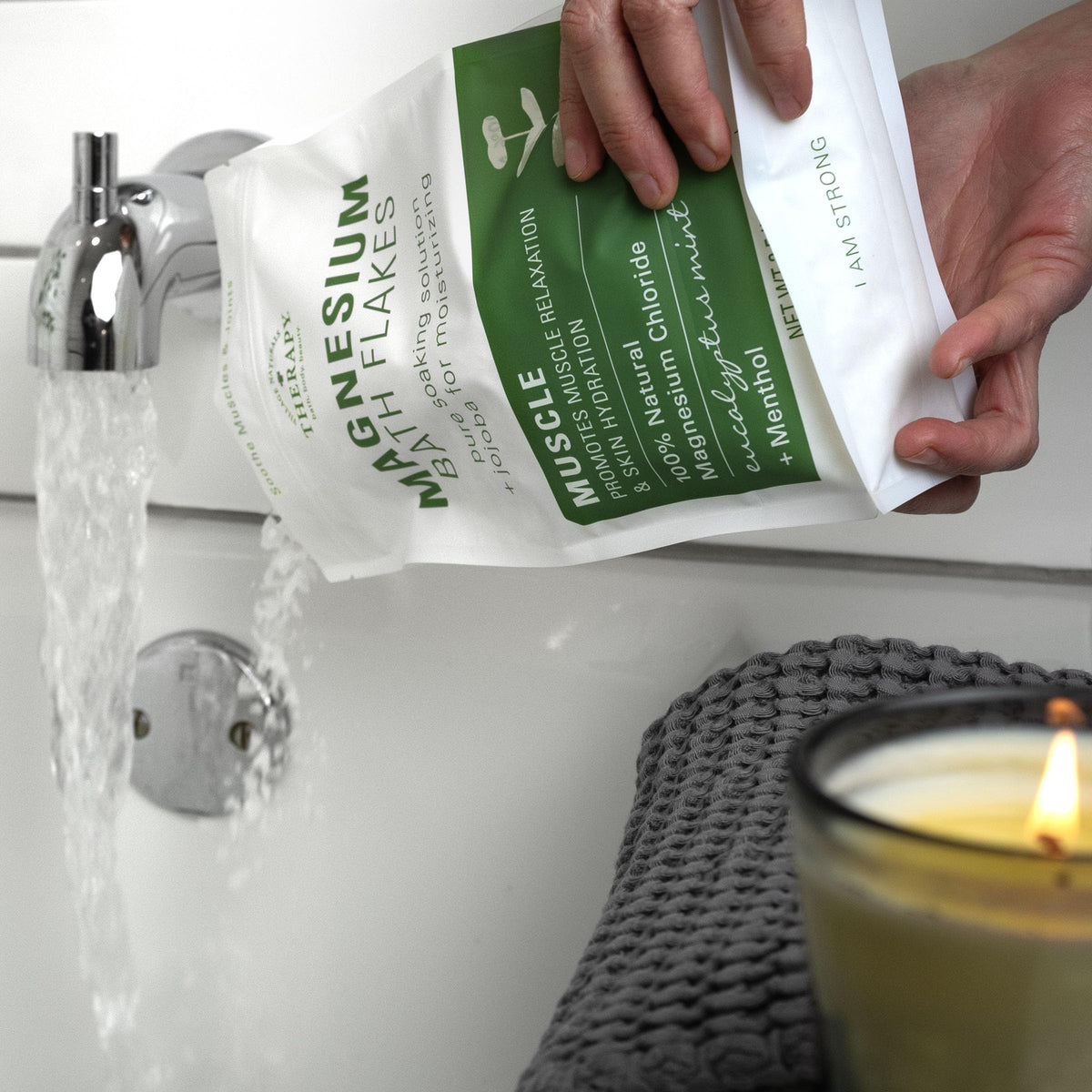 Village Naturals Therapy flakes dissolving in tub water for quick absorption
