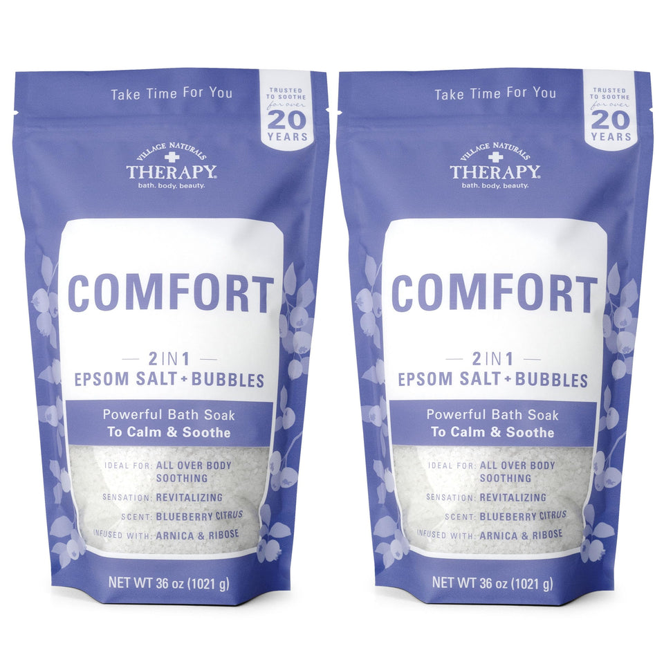 Village Naturals Therapy front packaging showing bottle and scent benefits