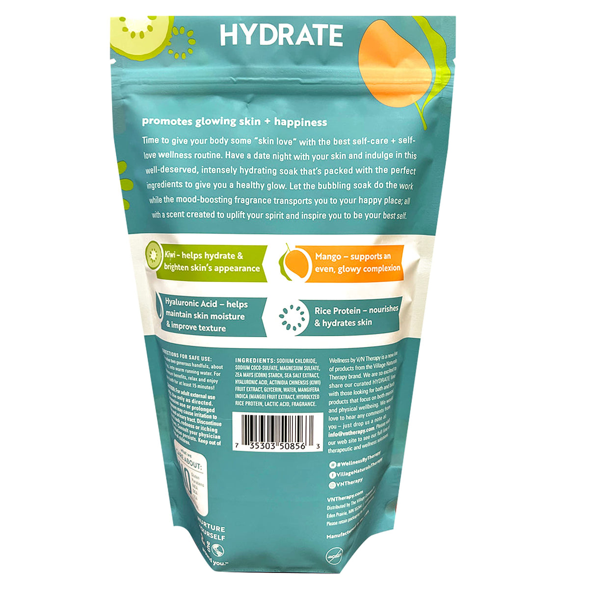 Village Naturals Therapy bottle label close-up highlighting ingredients and clarity