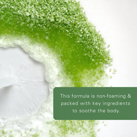 Village Naturals Therapy label close-up displaying ingredients and recommended capful dosing