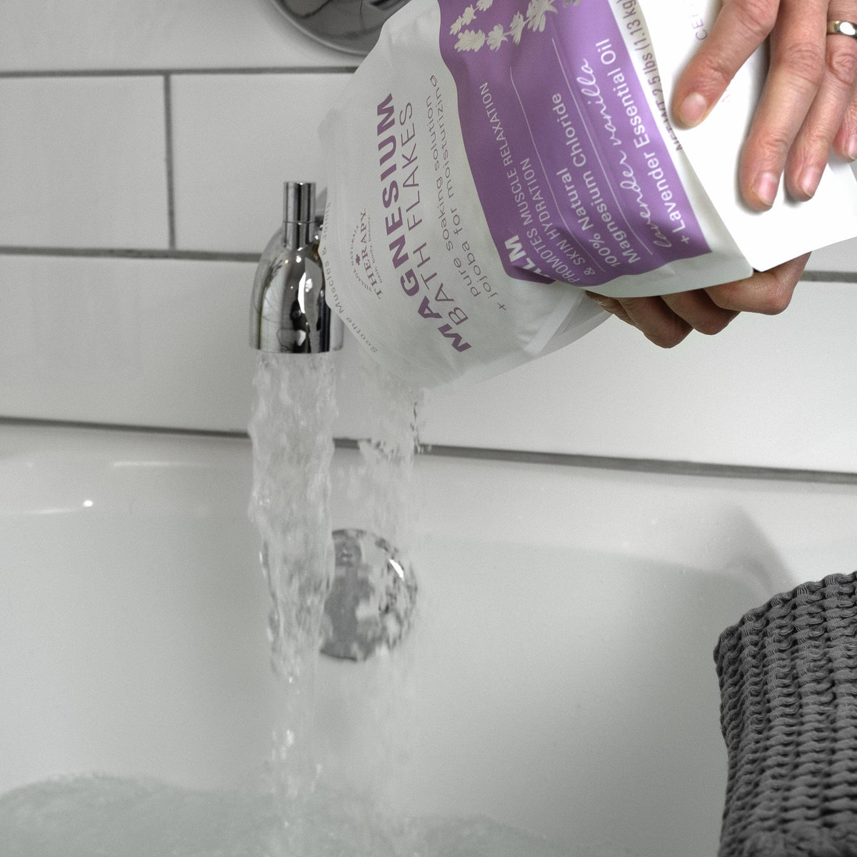 Label detail on Village Naturals Therapy tub showing lavender vanilla scent and ingredient highlights
