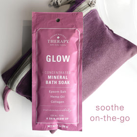 Village Naturals Therapy lifestyle bathroom spa setup suggesting relaxing at-home soak