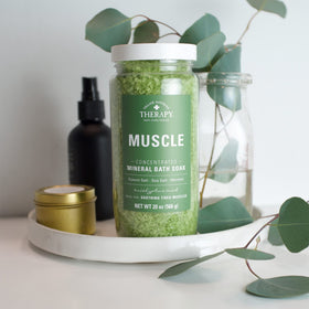 Village Naturals Therapy lifestyle bathroom scene conveying a calming, spa-like atmosphere