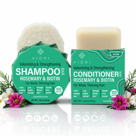 Viori front view of rosemary shampoo and conditioner bars showcasing compact plastic-free packaging and convenience
