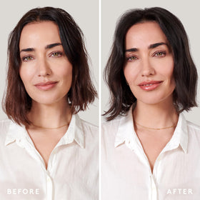 VIRTUE next to hand for scale illustrating bottle size and portability