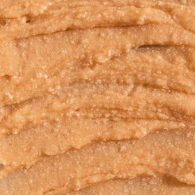 VITAMINS AND SEA BEAUTY woman applying scrub demonstrating gentle cleansing