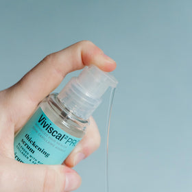 Viviscal pump and label close-up highlighting formula and ingredient clarity