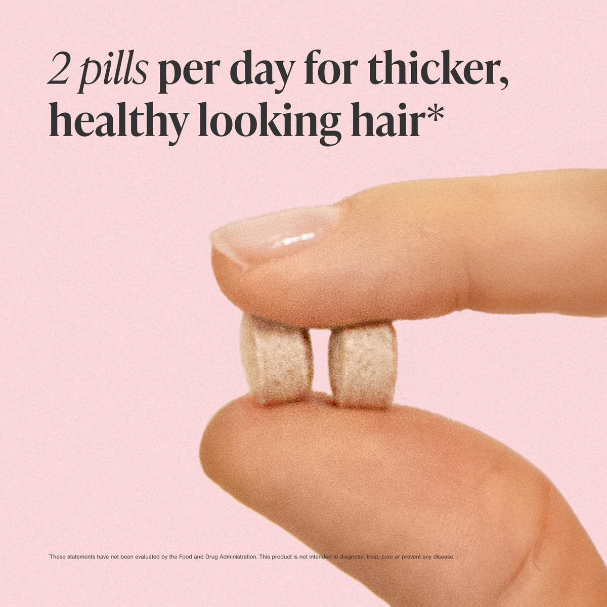Woman holding Viviscal tablet demonstrating simple twice-daily routine benefit