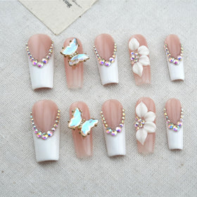 Vlazryk press-on nails styled with an elegant outfit for event-ready look