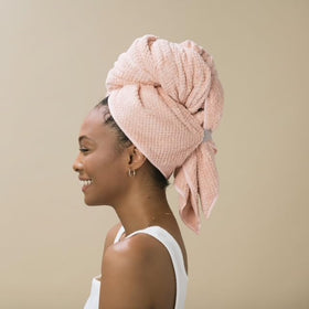VOLO Hero Hair Towel next to a hand showing large wrap coverage