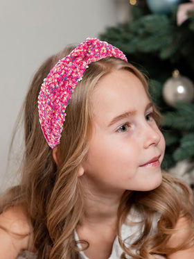 Vovii headband next to ruler showing size and flexible fit for kids