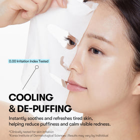 VT COSMETICS mask in hand being applied for instant cooling and de-puffing relief