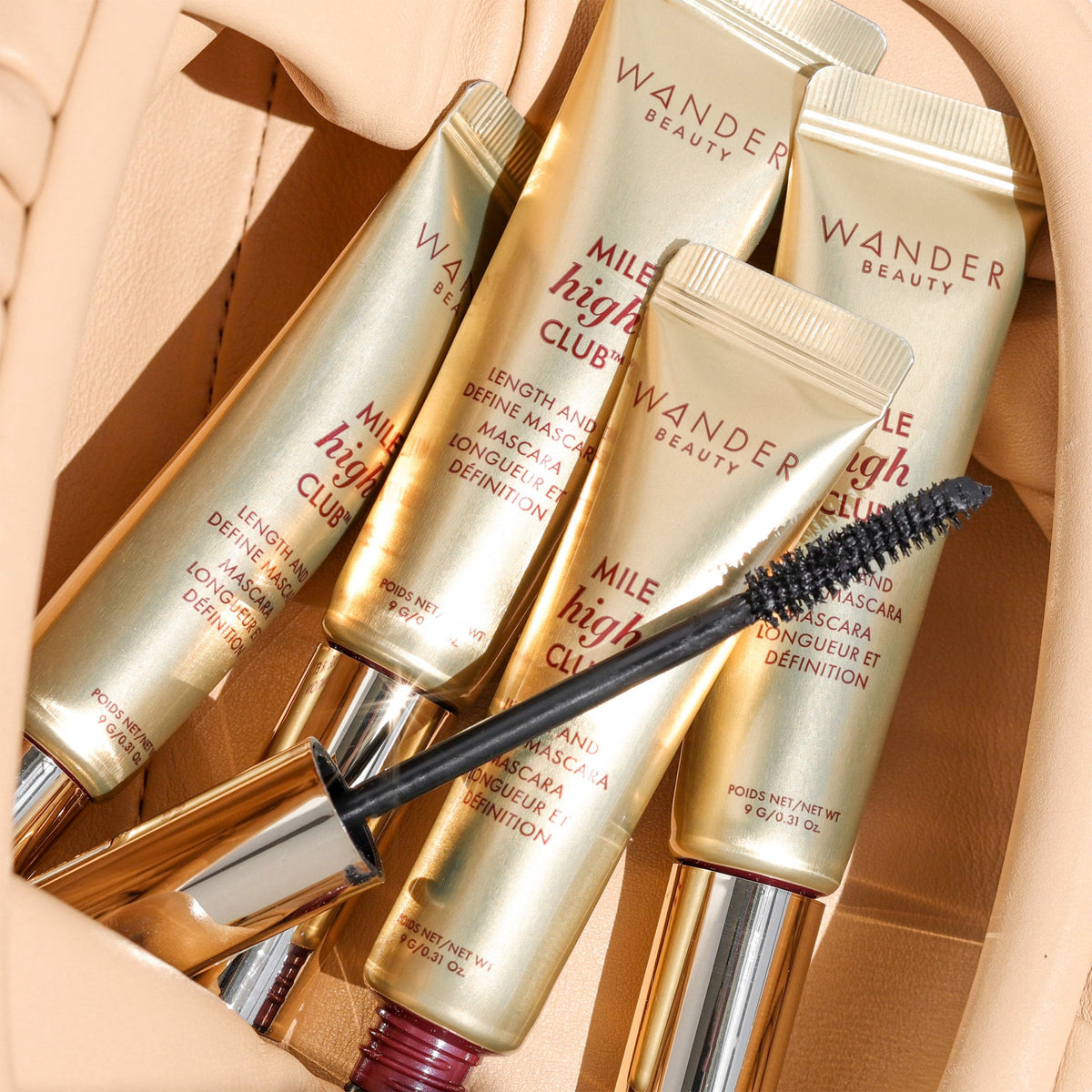 Wander Beauty mascara held in hand showing 0.31 fl oz scale