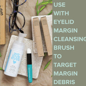 We Love Eyes bottle in hand showing product size and scale