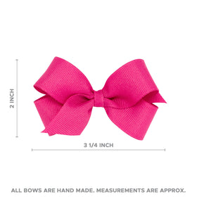 Wee Ones lifestyle baby photo wearing bow showing timeless charm and comfort