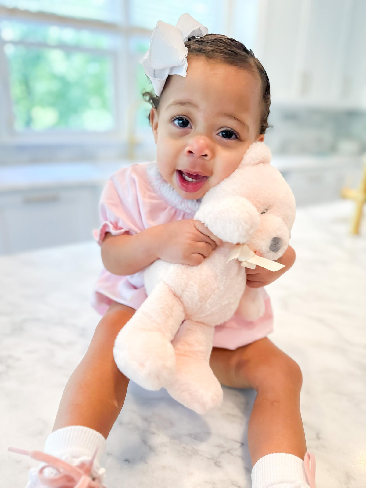 Wee Ones lifestyle girl wearing bow demonstrating secure hold and style