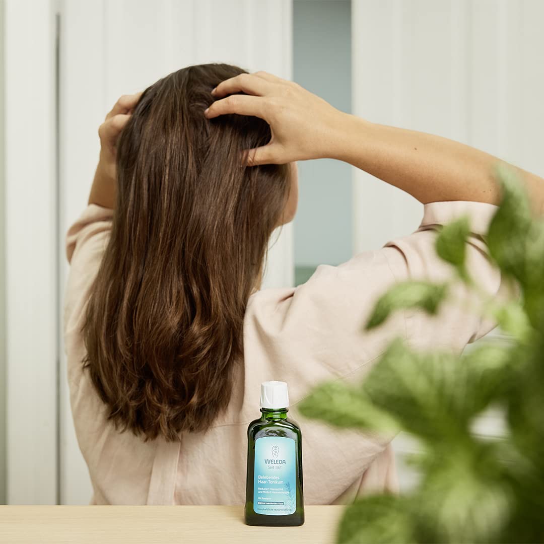 Weleda rosemary oil pouring close-up highlighting lightweight texture and absorption