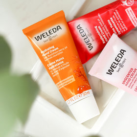 Weleda sea buckthorn applied on hands demonstrating hydration and non-greasy feel