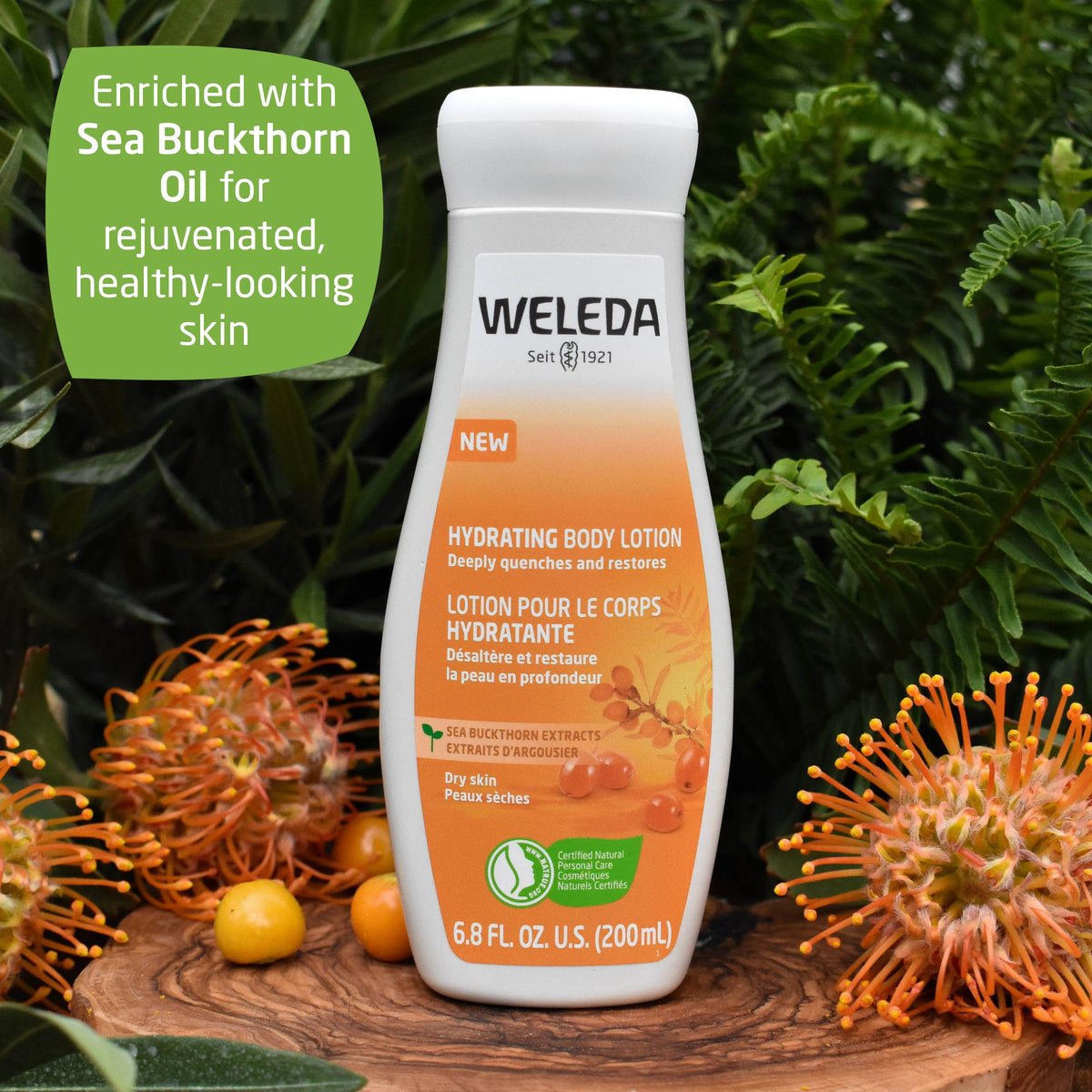 Weleda sea buckthorn beside hand for scale and travel-friendly size