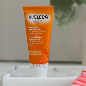 Weleda sea buckthorn tube beside coin for size comparison and portability benefit