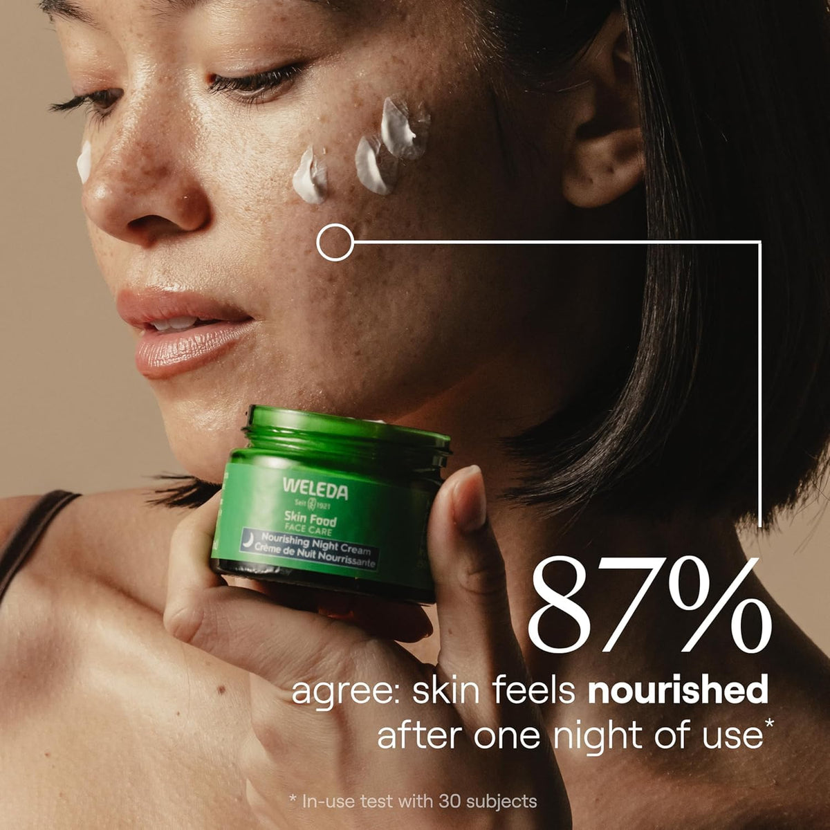 Weleda Skin Food cream being applied to hand demonstrating skin-softening effect