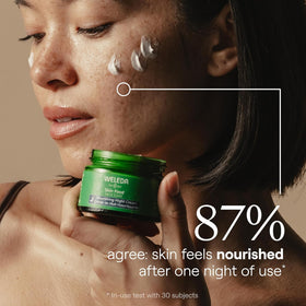 Weleda Skin Food cream being applied to hand demonstrating skin-softening effect