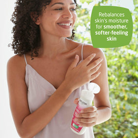 Weleda bottle in hand showing 6.8 fl oz scale and easy handling benefit