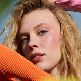 Well People Afterglow on lips demonstrating sheer color and hydrated finish