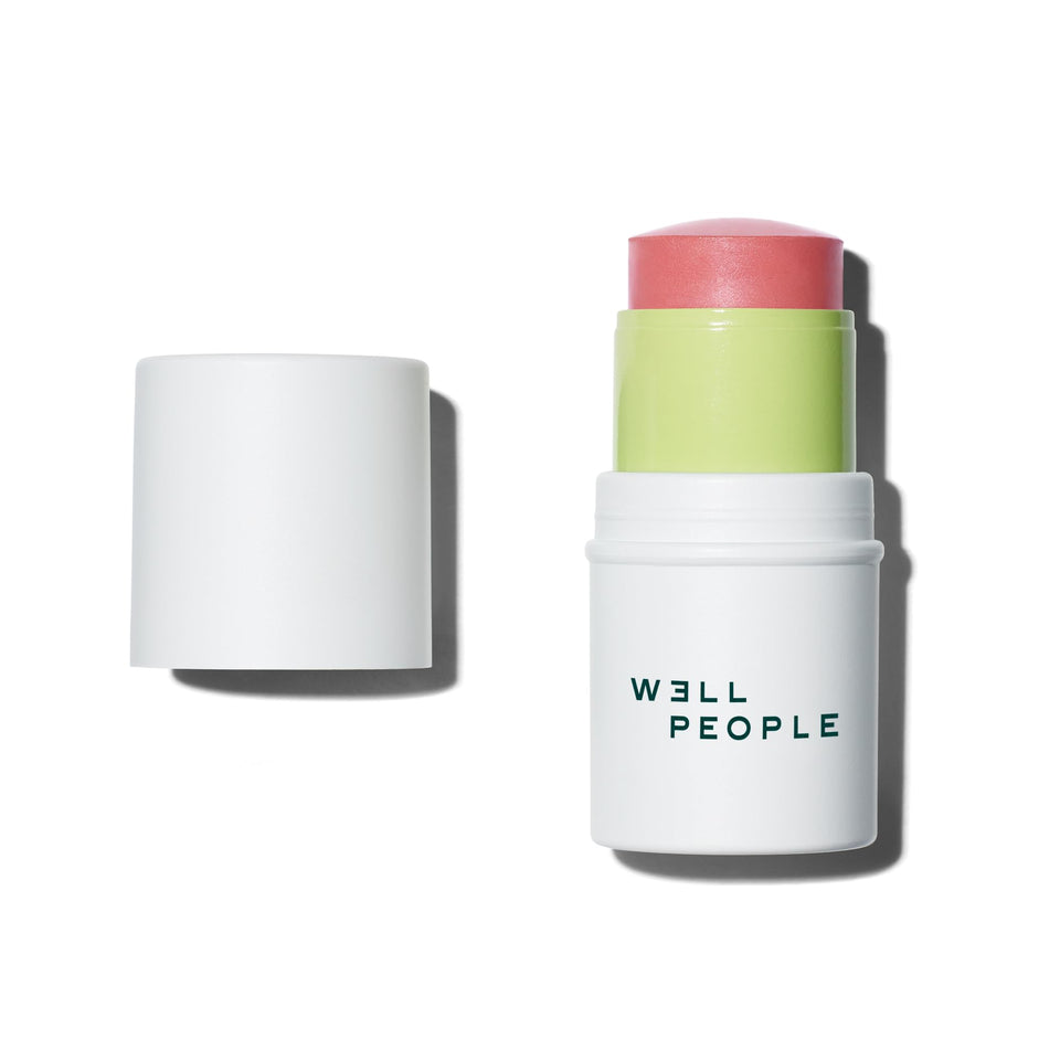 Well People blush stick front view showing berry shade and twist-up packaging for easy use
