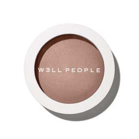 Well People bronzing powder compact front view showing shade and packaging benefits