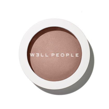 Well People bronzing powder compact front view showing shade and packaging benefits