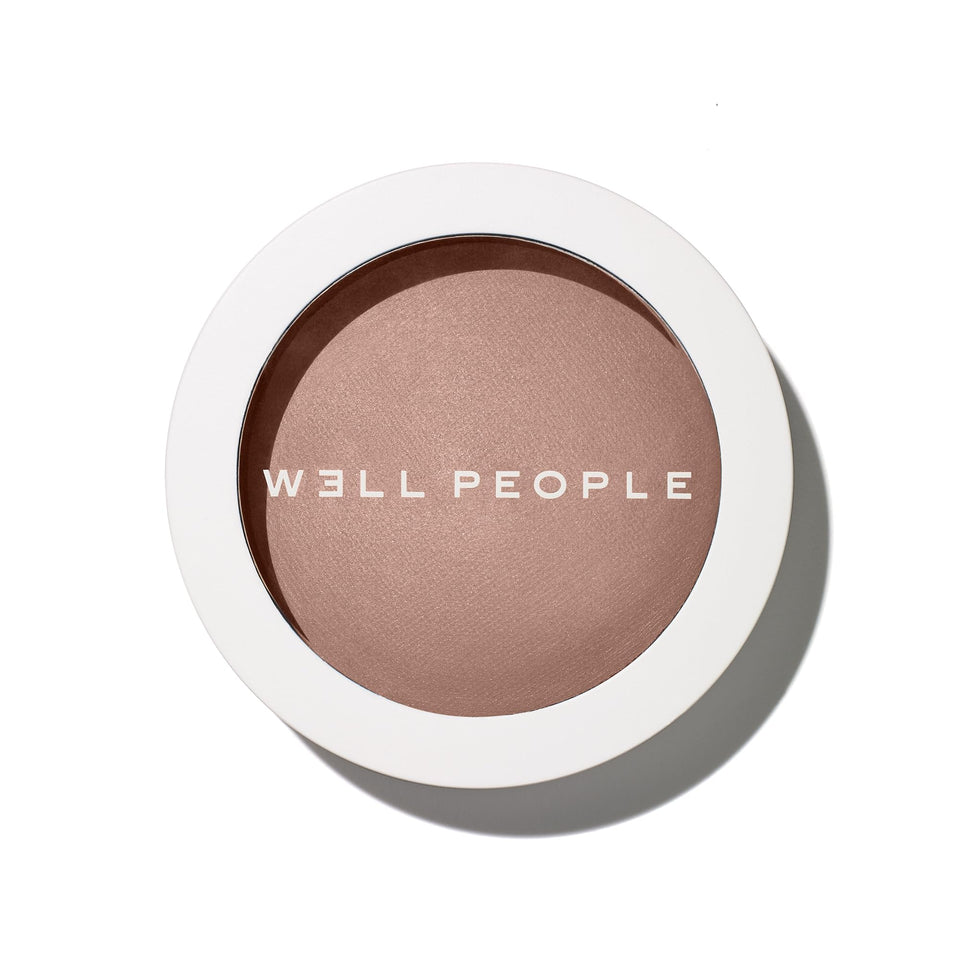 Well People bronzing powder compact front view showing shade and packaging benefits