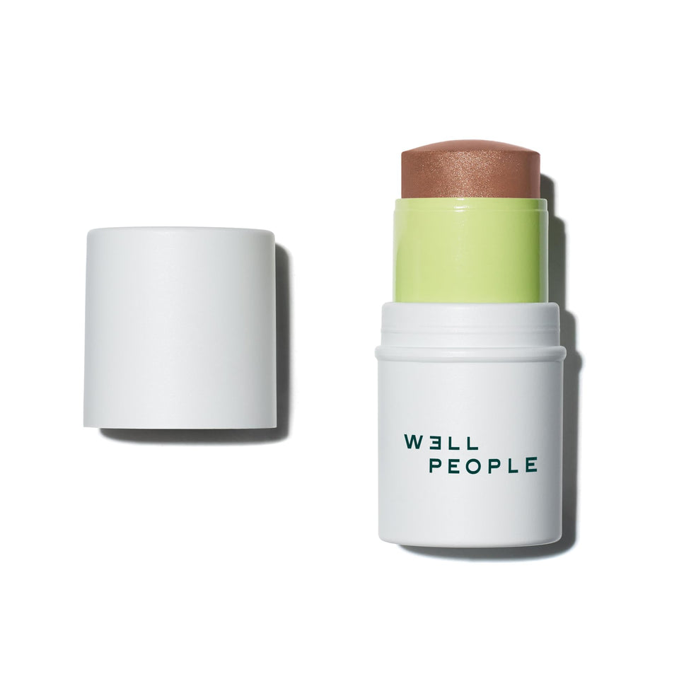 Well People bronzer stick front packaging showing neutral tan shade and stick format for easy use
