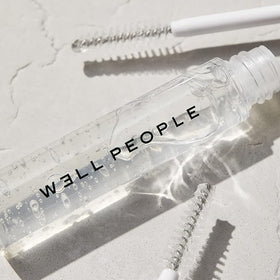 Well People product applied on eyebrow demonstrating taming effect
