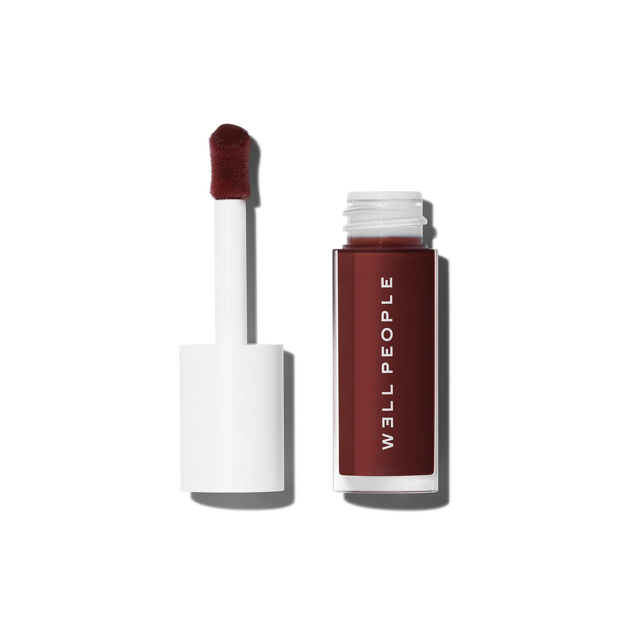 Well People front packaging showing Dewy Iris glossy tint and clean branding benefit