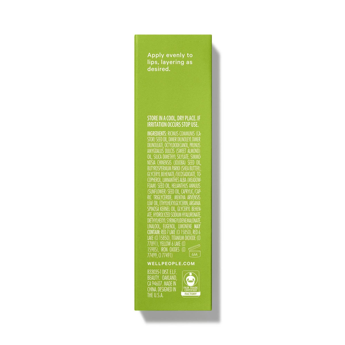 Well People lip oil tucked into a purse illustrating portable touch-up and hydration