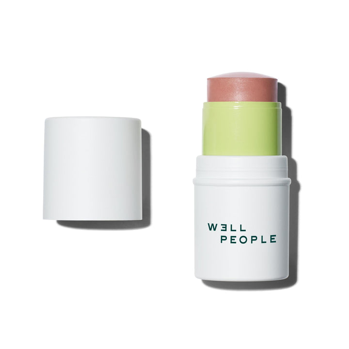 Well People stick front view showing Lychee shade and compact design benefit
