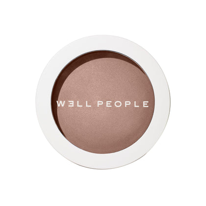 Well People compact front view showing bronzing powder for natural warmth